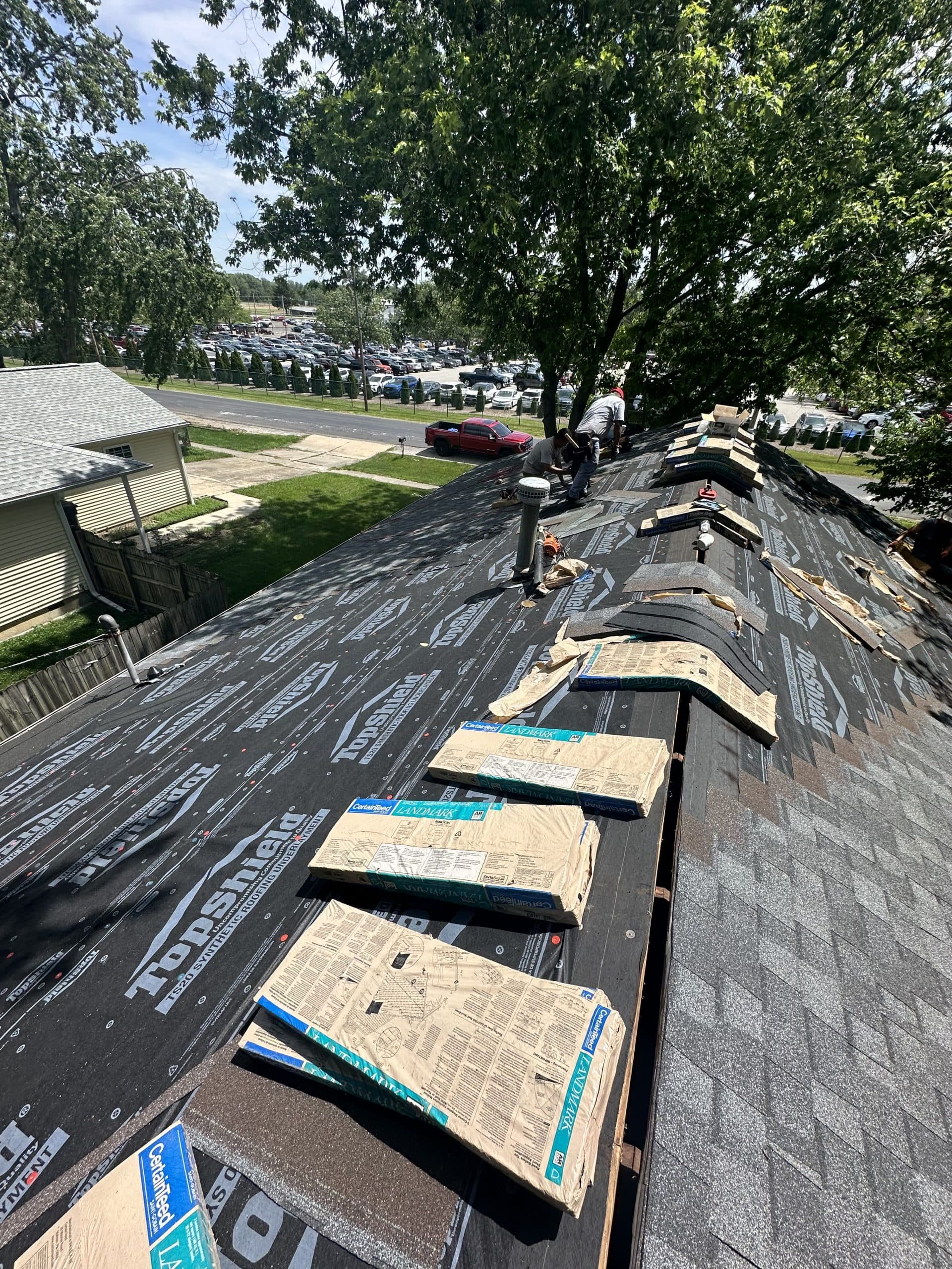 Pantheon roofer inspecting a residential roof in Champaign-Urbana