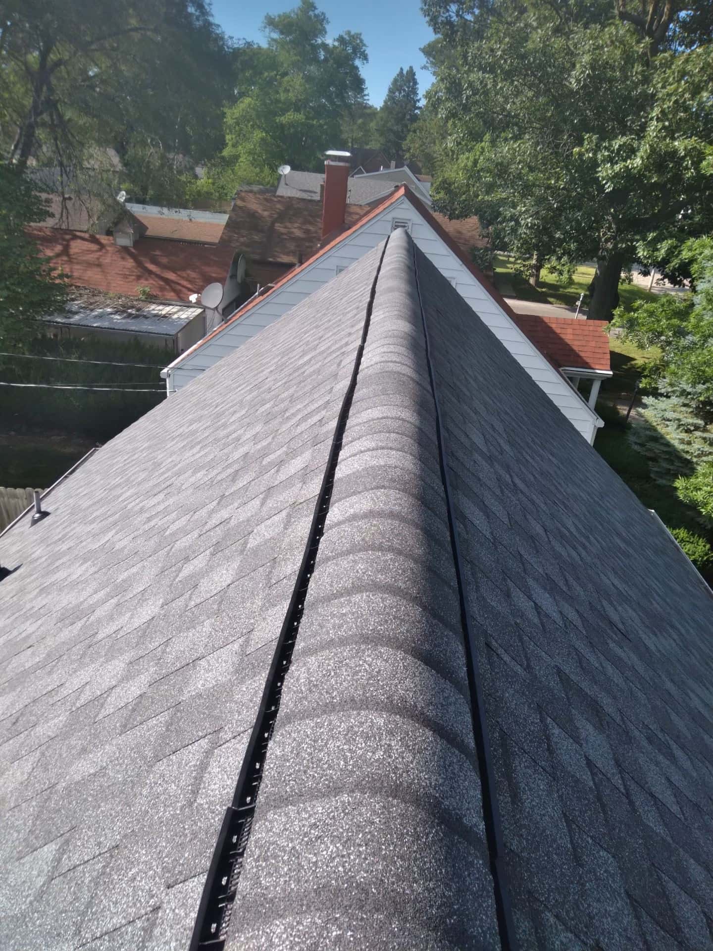 Ridge line of a finished Pantheon shingle roof