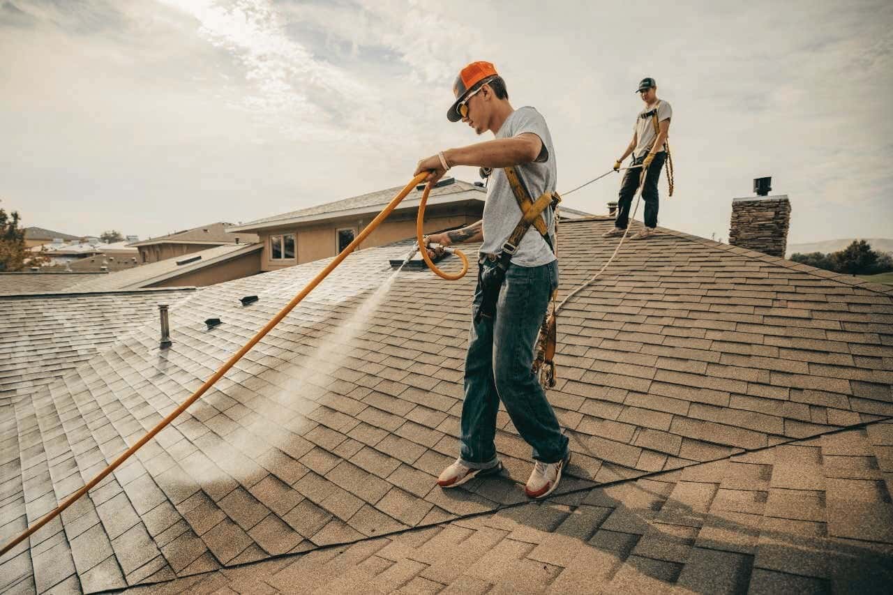 Roof Maxx rejuvenation being applied to an asphalt-shingle roof